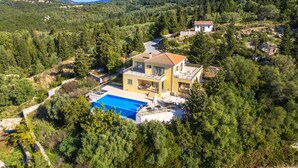 A two-story house with a swimming pool, surrounded by dense forest and mountains. - Villa Inna With 3 Bedrooms and 4 Bathrooms (Lefkada)