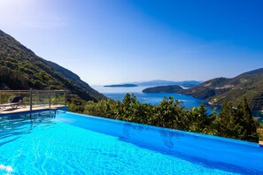 A swimming pool with a view of a coastal landscape. - Villa Inna With 3 Bedrooms and 4 Bathrooms (Lefkada)