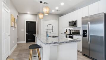 Coffee/tea maker, fridge, microwave, oven