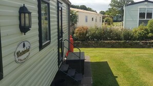 Cabin | Exterior detail - Lodgesleeps3-garden-balcony-parking-valleyview (Newton Stewart)