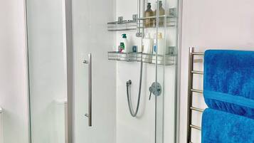 Shower, hair dryer, towels, soap
