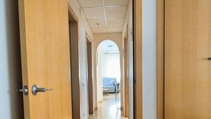 A hallway with wooden doors leading to rooms. - House in Riumar: Family Charm with Private Pool (Deltebre)