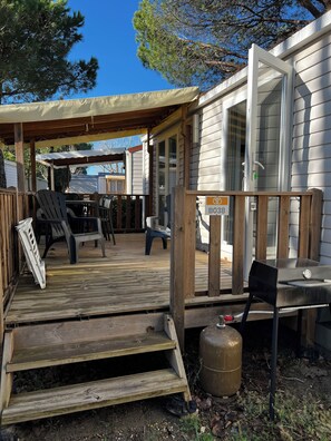 Enjoy al fresco dining on the deck with outdoor furniture and a barbecue grill.