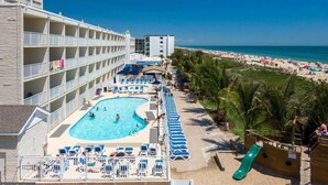 A hotel with a pool, beach, and ocean view. - Direct Oceanfront Condo with the Best Amenities (Ocean City)