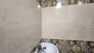 Deluxe Double Room, City View | Bathroom | Free toiletries, slippers, towels, soap