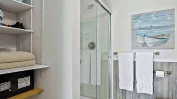 Shower, hair dryer, towels, shampoo