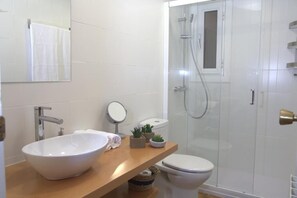 Shower, hair dryer, towels, soap