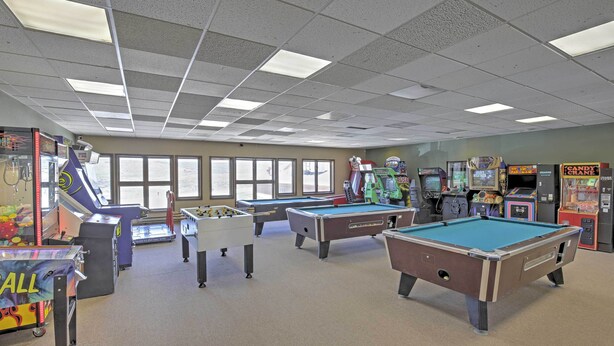 A recreation room with pool tables, foosball, and various arcade games. - 2 Mi to Granby Ranch: Studio w/ Resort Amenities! (Granby)