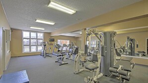 A gym with various exercise machines, large windows, and a mirror wall. - 2 Mi to Granby Ranch: Studio w/ Resort Amenities! (Granby)