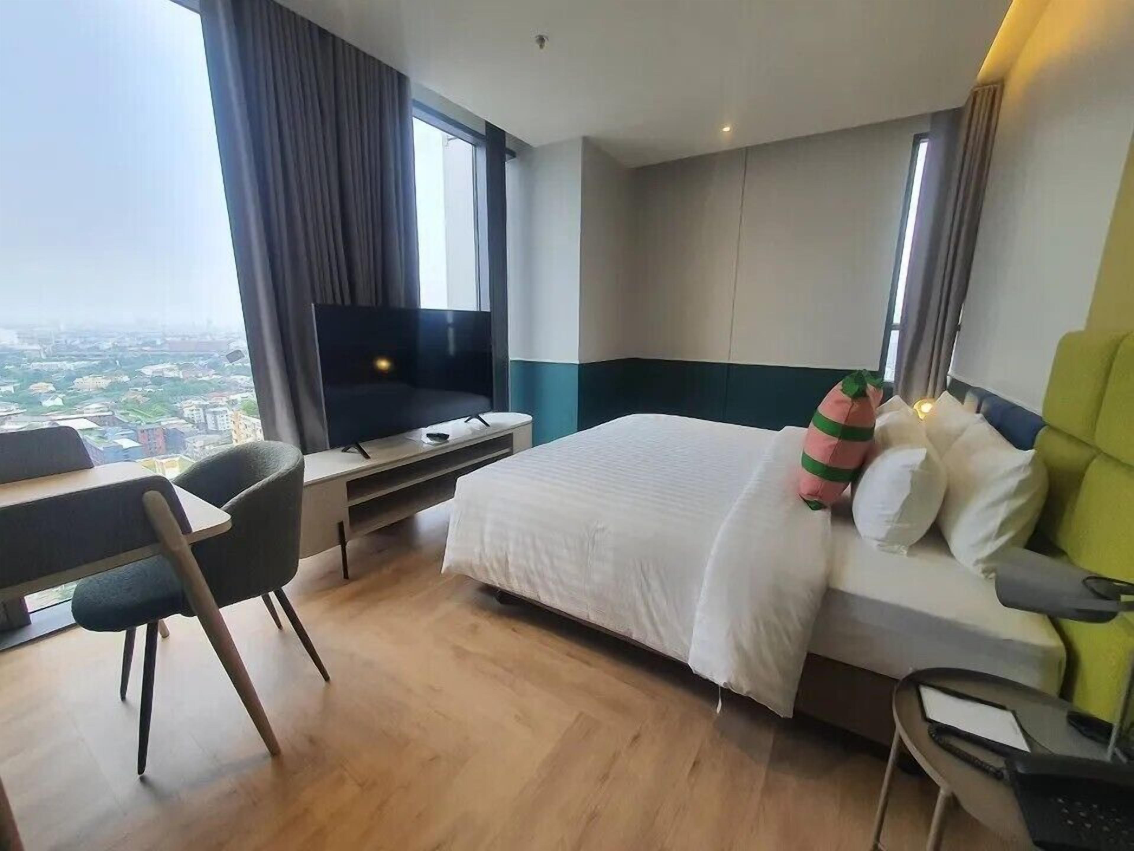 Suite | Een minibar, een kluis op de kamer, verduisterende gordijnen