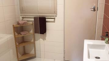 Shower, towels, soap, toilet paper