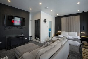 Deluxe Studio, Non Smoking, Ground Floor | 1 bedroom, blackout drapes, iron/ironing board, free WiFi