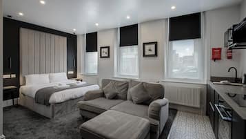 Deluxe Studio, Non Smoking, Ground Floor | 1 bedroom, blackout drapes, iron/ironing board, free WiFi