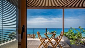 A balcony with a table set for two, overlooking a clear blue sea. - Villa Mulberry 10, Emma Villas (Sciacca)