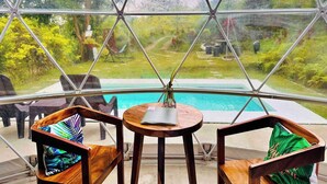 A geodesic dome structure with a pool and garden view. - Shanti Wellness Sanctuary (Lemery)