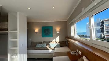 Premium Quadruple Room, Partial Sea View | Premium bedding, in-room safe, blackout drapes, free WiFi