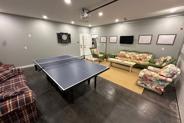 Dart board and ping pong table.