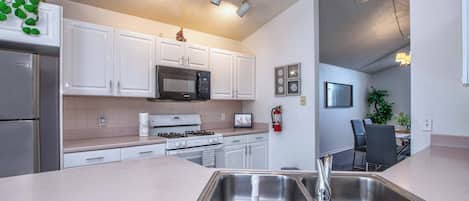 Coffee/tea maker, fridge, microwave, oven