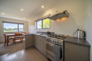 Fridge, microwave, toaster, cookware/dishes/utensils