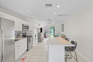 Prepare meals and socialize in this kitchen with a dining area and large island.