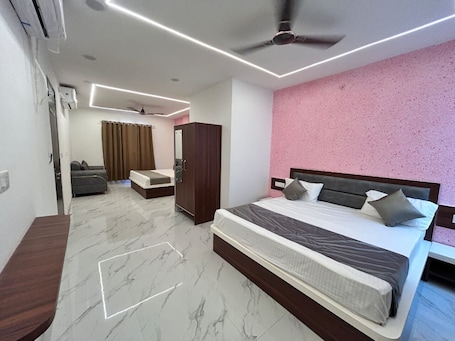 Suite, Private Bathroom | Desk, laptop workspace, soundproofing, iron/ironing board. Pratibha Hotel and Restaurant