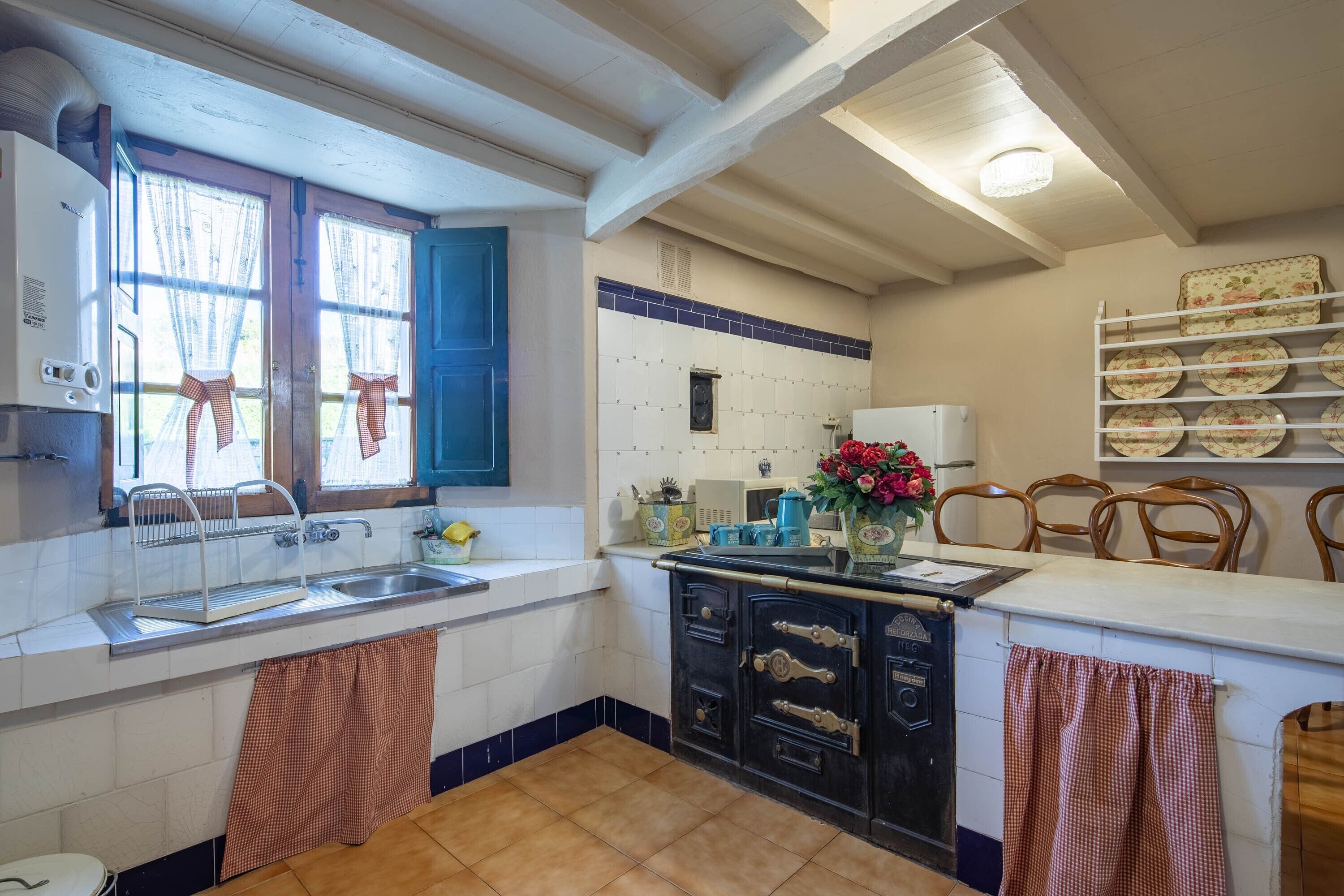 Fridge, microwave, coffee/tea maker, cookware/dishes/utensils