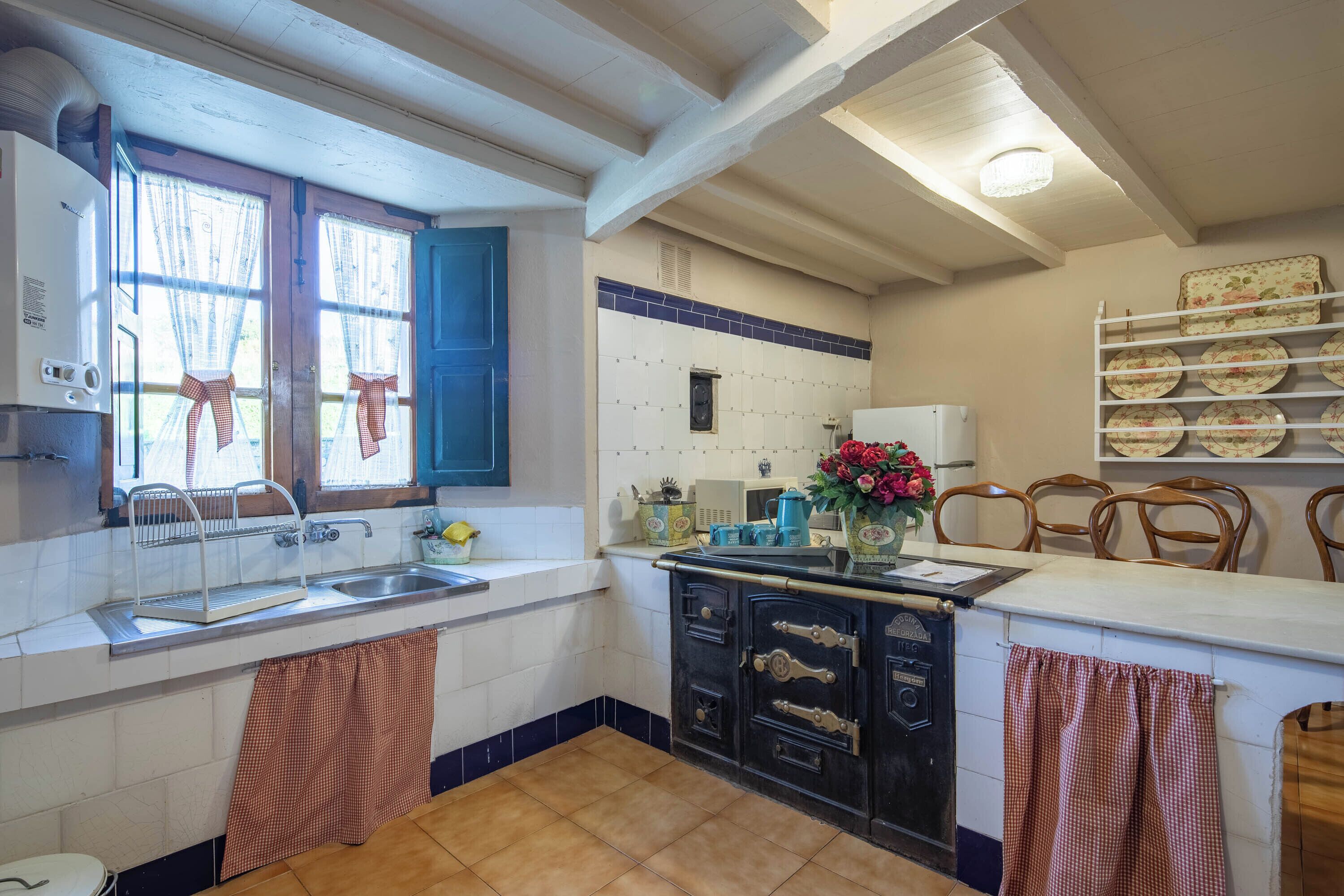 Fridge, microwave, coffee/tea maker, cookware/dishes/utensils