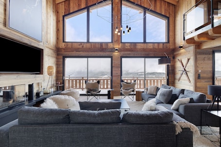 TV, fireplace. Chalet 'G2' with Lake View, Private Terrace and Wi-Fi