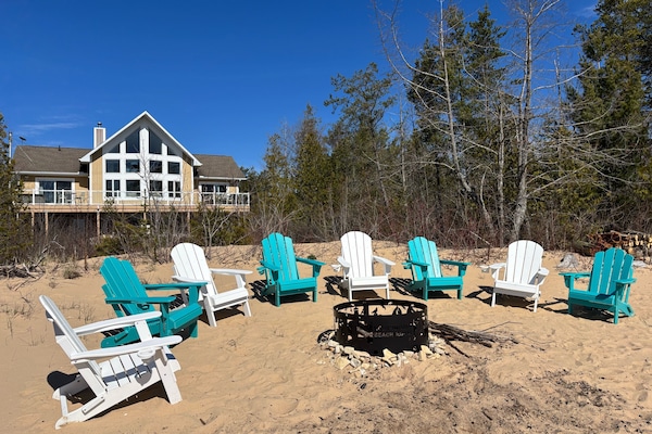 View of fire pit and house from beach