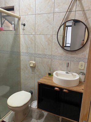 Shower, hair dryer, soap, toilet paper