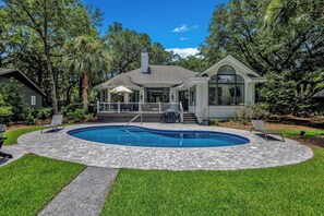 A heated pool - Spacious Coastal Getaway | Private Pool, Lagoon Views with Dock, Balcony, and Yard (Hilton Head Island)
