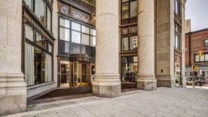 A historic building with large stone columns, ornate windows, and a grand entrance. - Baltimore executive Furnished rentals (Baltimore)