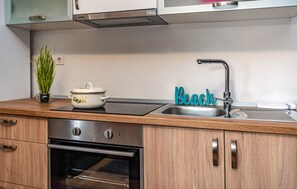 Fridge, oven, coffee/tea maker, cookware/dishes/utensils