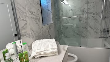 Hair dryer, towels, soap, shampoo