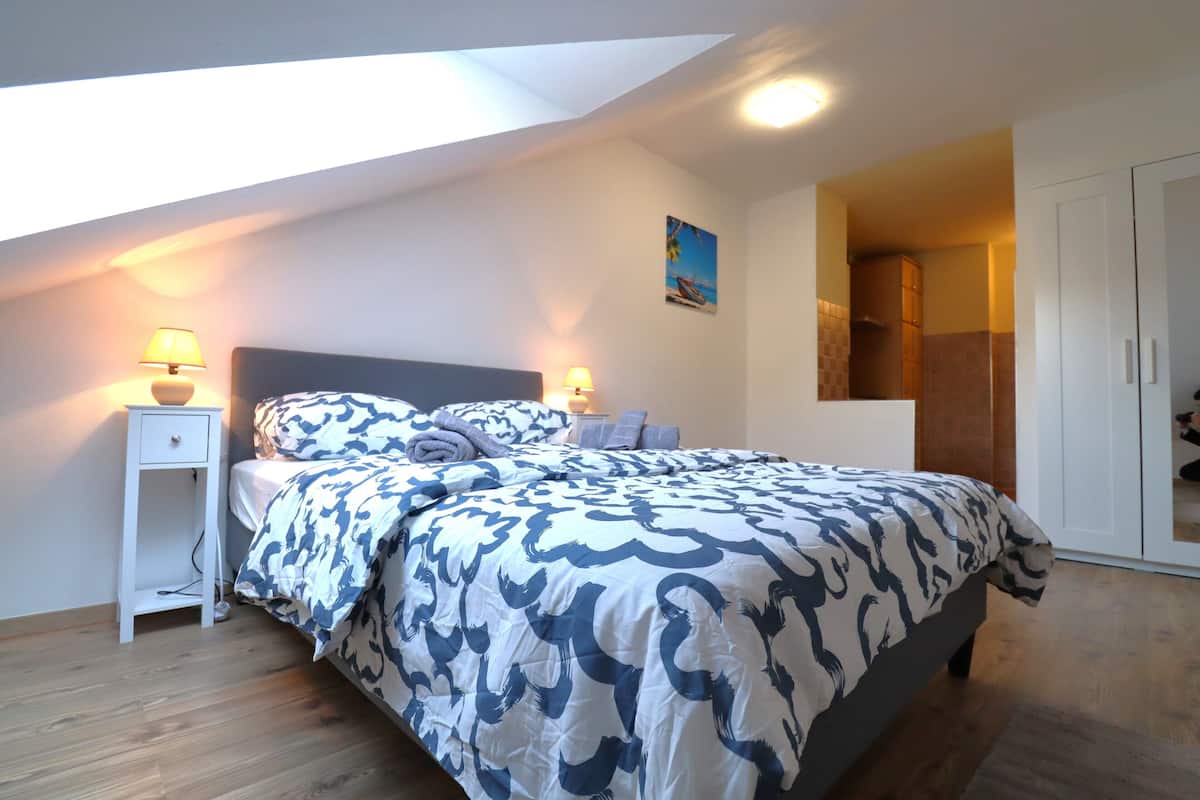 Deluxe Apartment, Kitchen, Courtyard View | 2 bedrooms, desk, laptop workspace, iron/ironing board