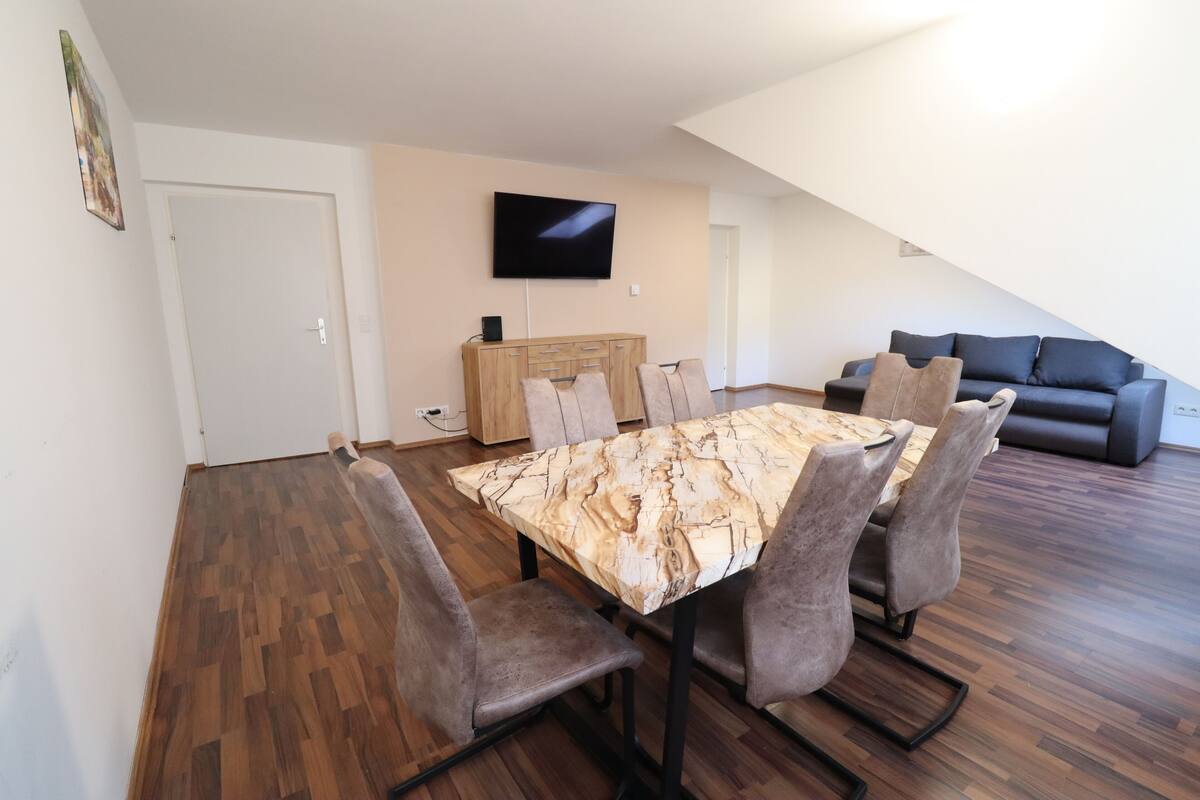 Deluxe Apartment, Kitchen, Courtyard View | Living area | Flat-screen TV