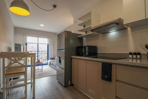 Fridge, microwave, stovetop, coffee/tea maker