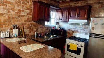 Fridge, microwave, oven, cookware/dishes/utensils