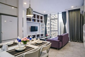 Appartement Deluxe, vue ville | Coin séjour