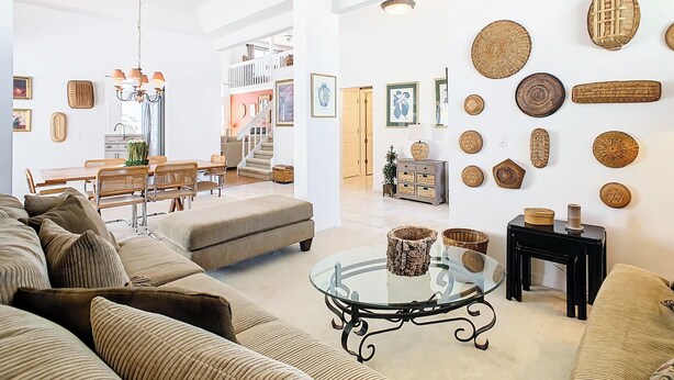 A spacious living area with a glass coffee table, a sofa, and a dining area with a table and chairs. - 🏰 Disney Area 3BR Pool Home | Family-Friendly | Minutes to Golf & Attractions (Davenport)