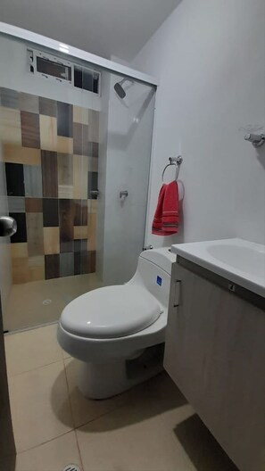 Shower, towels, soap, toilet paper