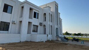 A modern building with multiple balconies and large windows. - The Black Eagle Resort (Pushkar)