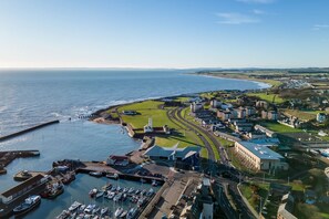 A coastal town with a marina, roads, and buildings. - Sea Views Luxury Apartment Free Parking - Coast Ap (Arbroath)
