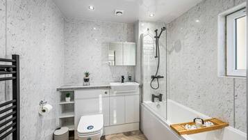 Shower, hair dryer, towels, soap