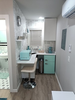 Fridge, microwave, coffee/tea maker, cookware/dishes/utensils