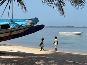 On the beach, sun-loungers