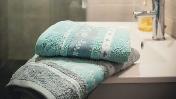 Hair dryer, towels, soap, toilet paper
