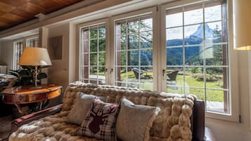 Luxury Chalet, Mountain View | Living area | 42-inch flat-screen TV with cable channels