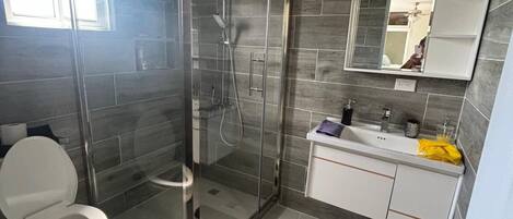 Shower, hair dryer, towels, soap