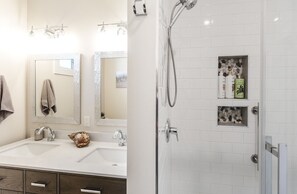 Shower, hair dryer, towels, soap